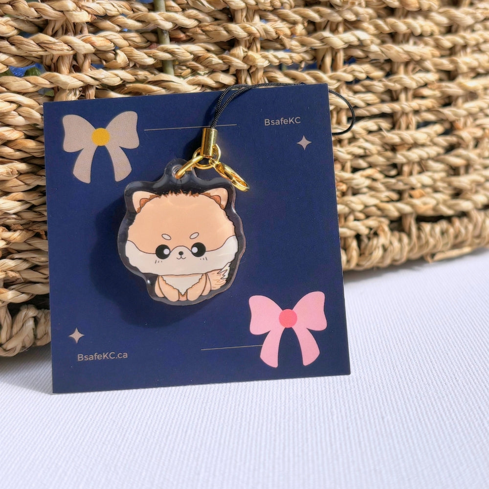 Orange pomeranian phone charm